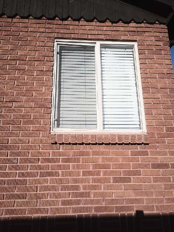 Upper bedroom window with new screen installation